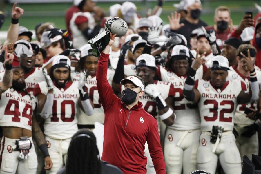 Oklahoma Sooners Head Coach Lincoln Riley holds up the championship trophy after the 2020 Dr. Pepper Big 12 Championship on Dec.  19 at AT&T Stadium in Arlington, Texas. 