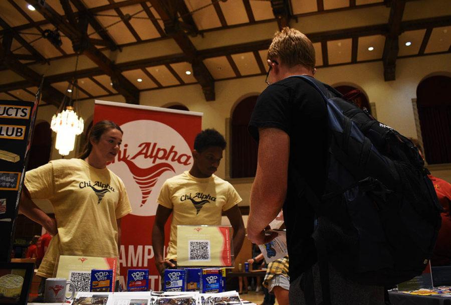 An Iowa State student visits the Chi Alpha Campus Ministry table at the 2021 Clubfest on Wednesday in the Memorial Union.
