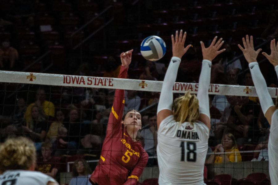 Brooke Andersen is seen jumping up to spike the ball
