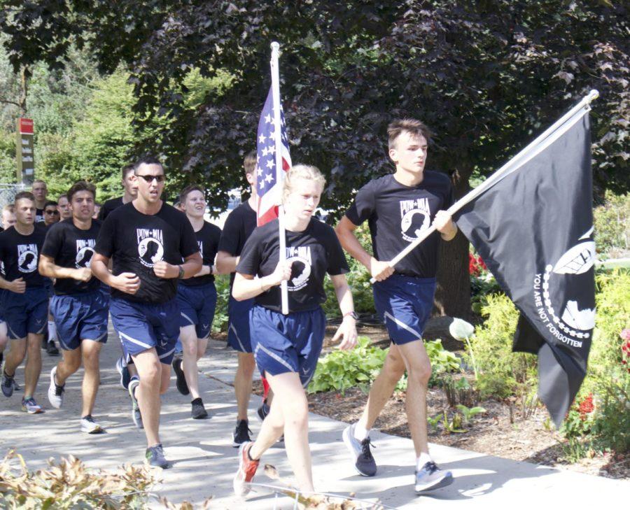 Iowa State Universitys AFROTC members approaching the finish line of their 35 mile run honoring POW/MIA Day.