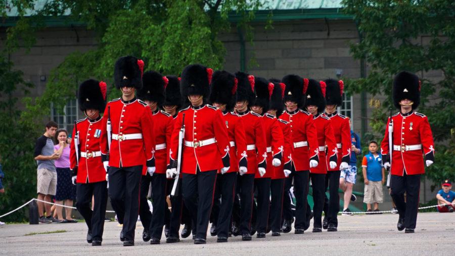 Lining up in row, Royal Guards from Quebec prepare to make their way towards the United States (while youre distracted with all four downs in American football) to bump uglies with your broad.