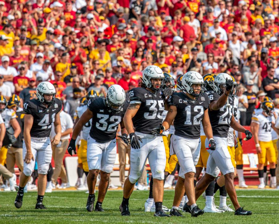 Iowa+States+defense+walks+back+to+the+sideline+after+a+play+against+No.10+Iowa+on+Sept.+11.