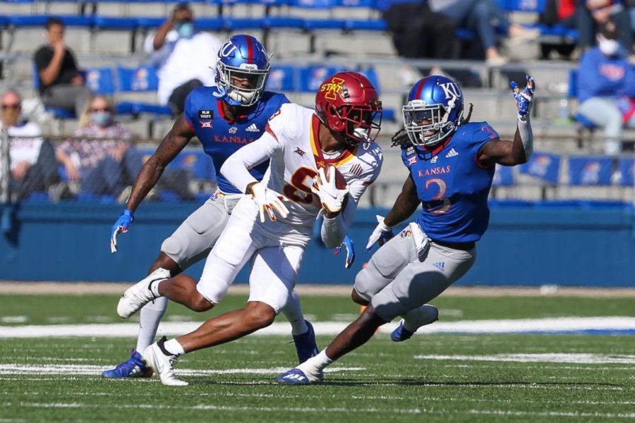 Iowa State wide receiver Joe Scates tries to spin away from defenders after a catch against the Kansas Jayhawks on Oct. 31 at Memorial Stadium in Lawrence, Kansas.