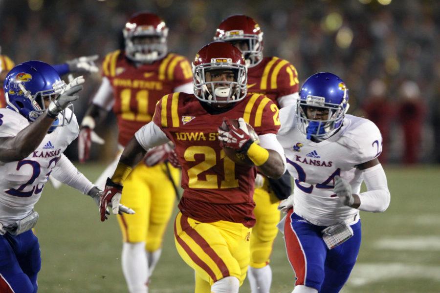 Running+back+Shontrelle+Johnson+runs+to+the+end+zone+with+Jayhawks+trailing+after.+Johnson+ran+for+84+yards+and+scored+a+touchdown+during+the+game%C2%A0against+Kansas+on%C2%A0Saturday%2C+Nov.+23%2C+at+Jack+Trice+Stadium.+The+Cyclones+shut+out+the+Jayhawks+with+a+final+score+of+34-0.
