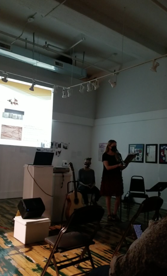 Debra Marquart reads one of her poems at a gallery talk hosted by the Octagon Center for the Arts.