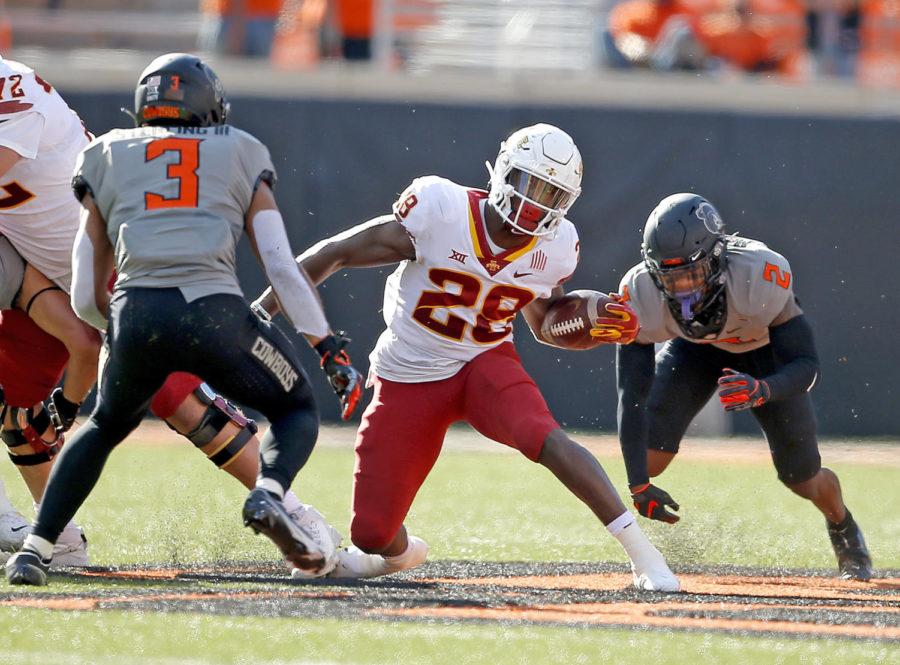 Iowa State running back Breece Hall attempts to juke out an Oklahoma State defender during the Cyclones and Cowboys game Saturday in Stillwater, Oklahoma on Oct. 24, 2020