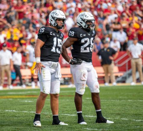 Brock Purdy (left) and Breece Hall (right) look to the sideline for a play call against No.10 Iowa on Sept. 11.