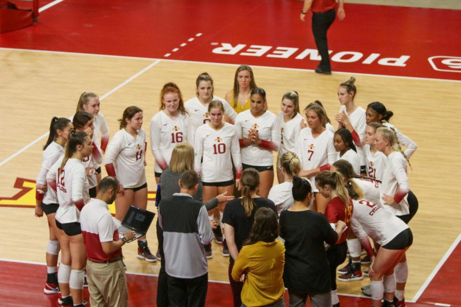 Iowa State volleyball players talk with Head Coach Christy Johnson Lynch during their match against TCU on Sept. 24. 