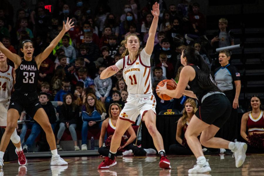 Emily Ryan reaches up to defend the hoop against Omaha on Nov. 9 in Hilton Coliseum. The Cyclones won their season opener 65-38.