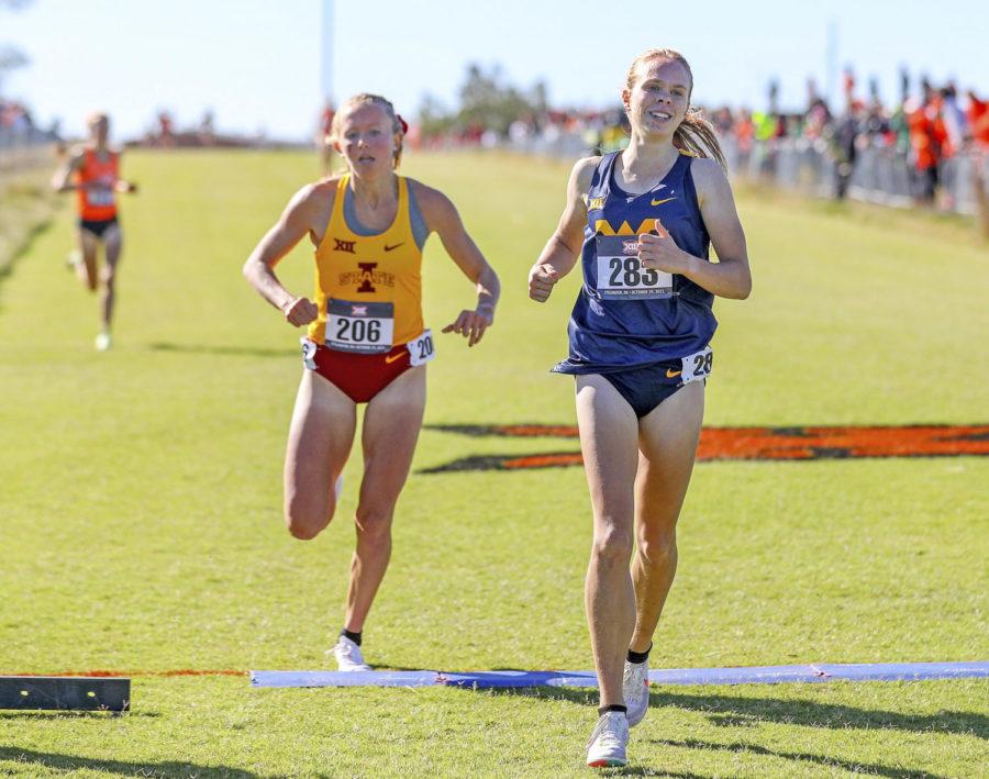 Ceili McCabe finishes first at the 2021 Big 12 Womens Cross Country Championship on Oct. 29, with Iowa State senior Cailie Logue finishing in second place.