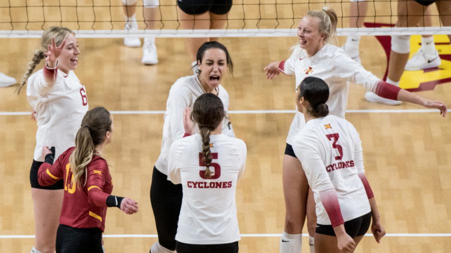 Iowa State volleyball players celebrate after a point against Kansas State on Thursday in Hilton Coliseum. (Photo courtesy of Luke Lu/Iowa State Athletics)