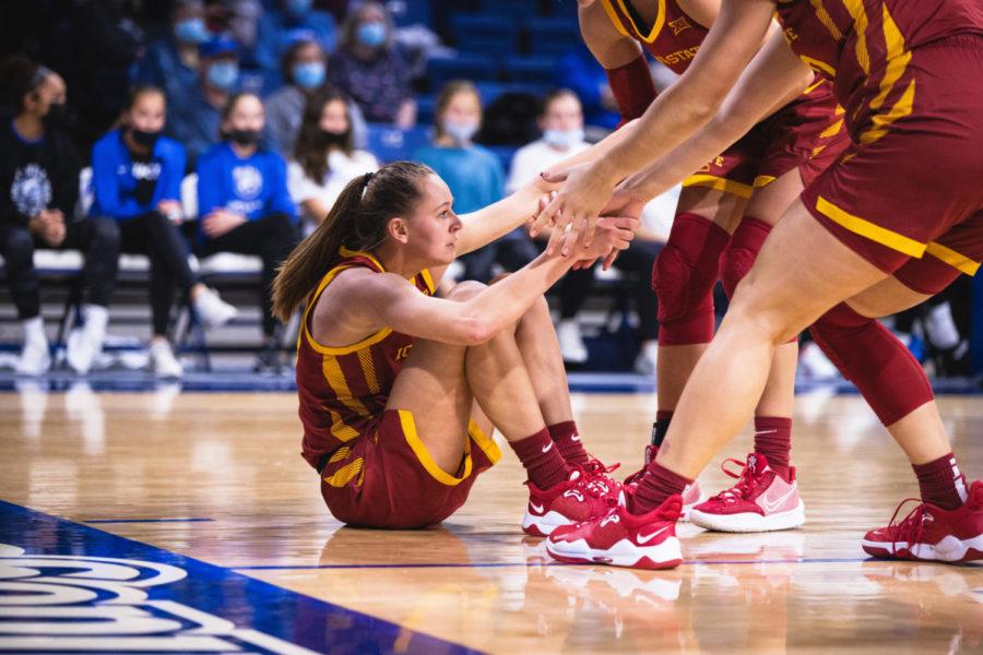 Aubery Joens gets helped up by teammates in the Cyclones 98-76 win over Drake on Nov. 18. 