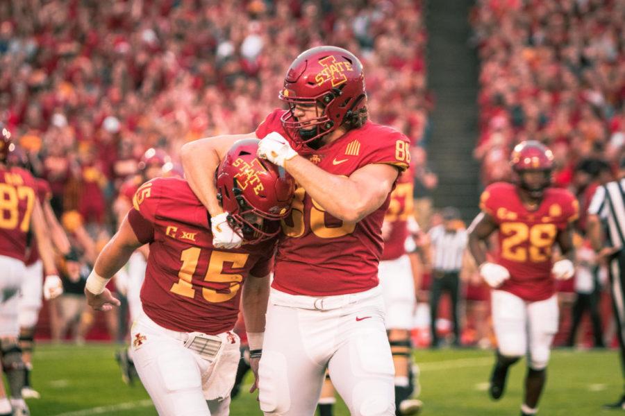 Charlie Kolar celebrates a touchdown with Brock Purdy during Iowa States 59-7 win over Kansas on Oct. 2.