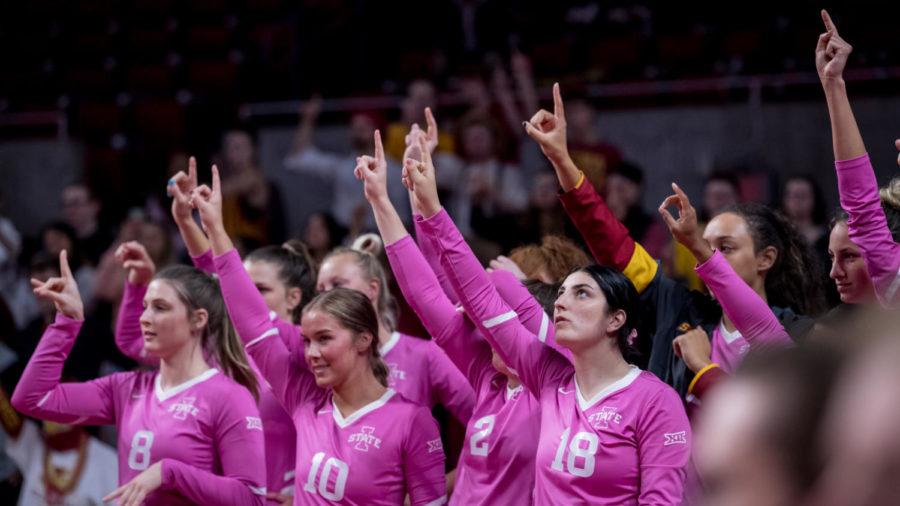 Iowa State volleyball players hold up their fingers in the Cyclones match against West Virginia on Oct. 30.