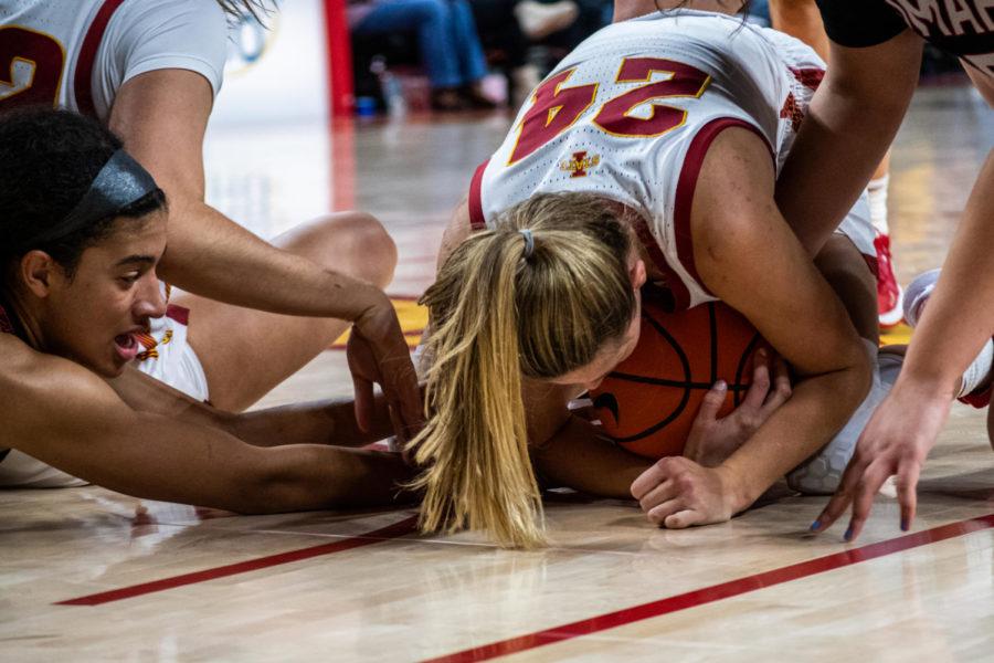 Ashley Joens covers the ball with her body to get the jump ball against Omaha on Nov. 9 in Hilton Coliseum.