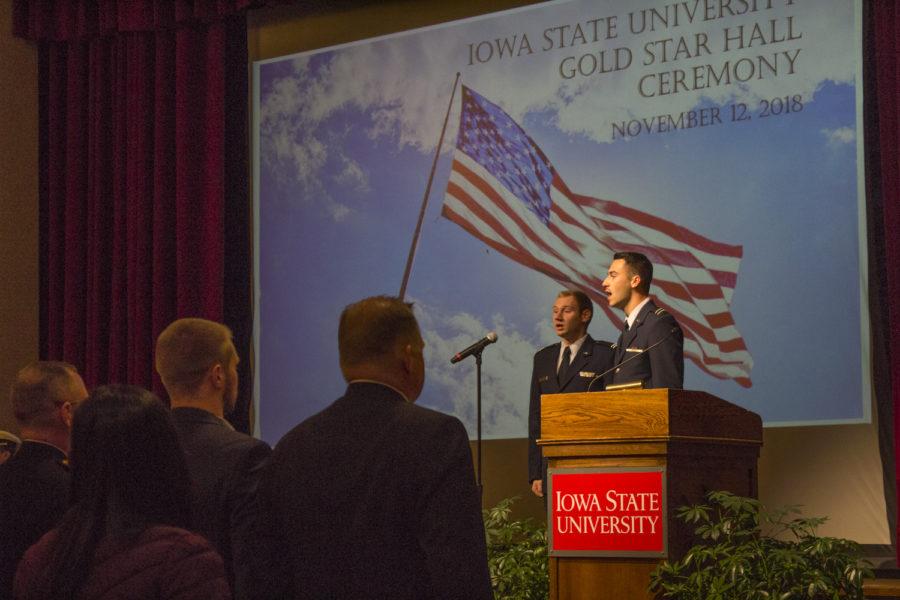 ROTC students Jackson Koster (graduated) and senior Colin Long sing the National Anthem at the Gold Star Hall Ceremony. The Gold Star Hall Ceremony was held Nov. 12, 2018 in the Great Hall of the Memorial Union. The ceremony honored three fallen WWII service members, and celebrated the one hundred year anniversary of the end of WWI and the ninety year anniversary of the Memorial Union.