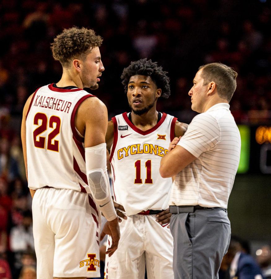 Iowa State head coach T.J. Otzelberger talks with Gabe Kalscheur and Tyrese Hunter during the Cyclones 47-37 win against Jackson State on Dec. 12.