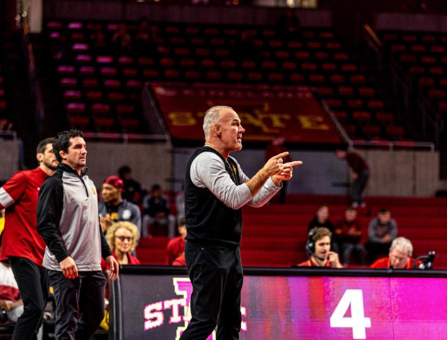 Iowa State wrestling coach Kevin Dresser watches the Cyclones compete in their dual against Army on Nov. 27.