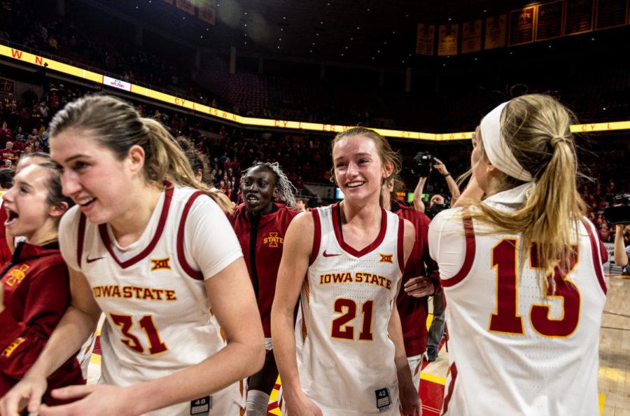 Lexi Donarski smiles as she and her teammates celebrate after beating Iowa 77-70 on Wednesday.