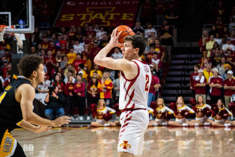 Caleb Grill looks around the court trying to pass to a teammate in the game against Arkansas Pine-Bluff on Dec. 1 in Hilton Coliseum.