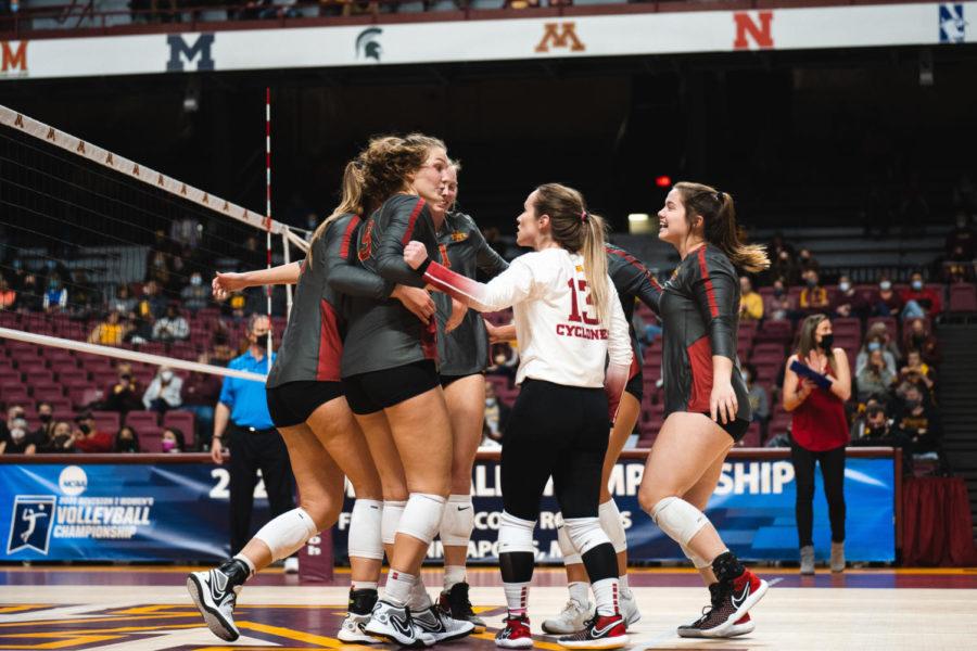 Iowa State volleyball huddles after recording a point against Stanford at the NCAA Tournament.