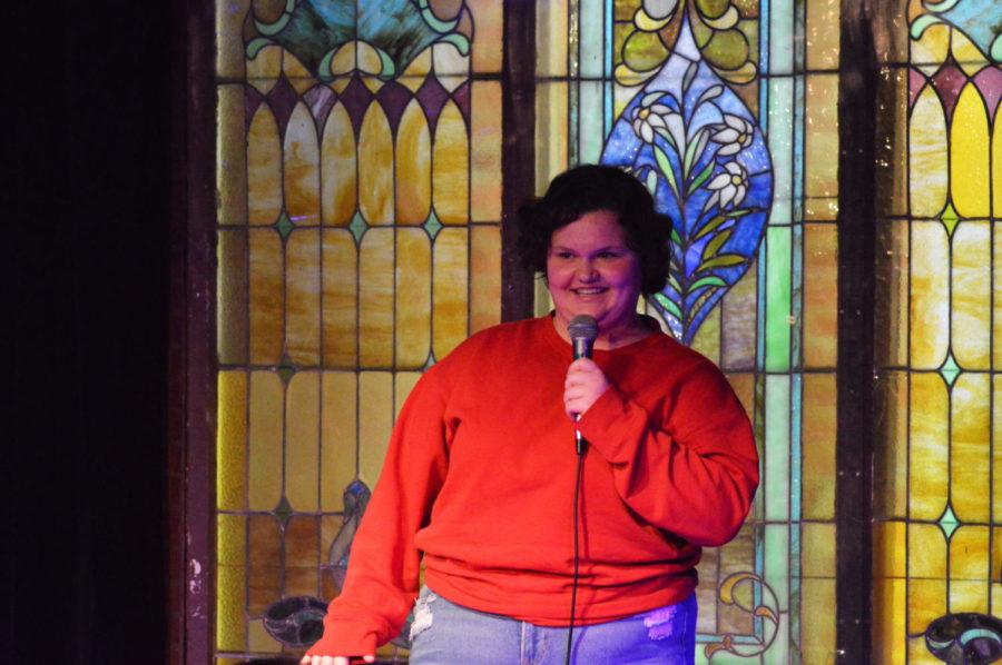Chasey Sedam performing stand-up comedy at a Student Union Board Open Mic Night. 