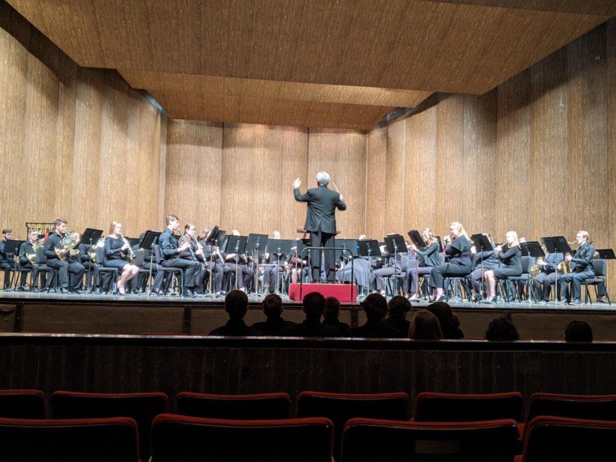 Michael Golemo conducting the Symphonic Band inside Stephens Auditorium