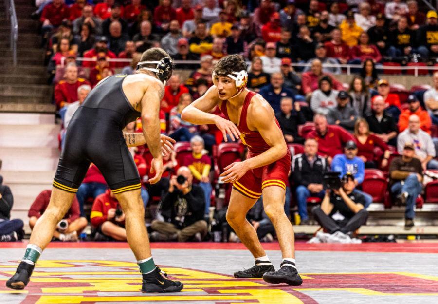 Iowa State sophomore Zach Redding wrestles against Iowas Jaydin Eierman in the Cyclones 22-11 loss to the No. 1 Hawkeyes on Dec. 5.