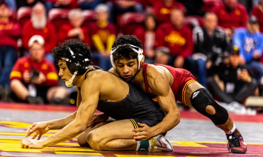 Kysen Terukina wrestles against Iowas Jeese Ybarra in the Cyclones dual against No. 1 on Dec. 5. Terukina won the match in a decision 8-2.