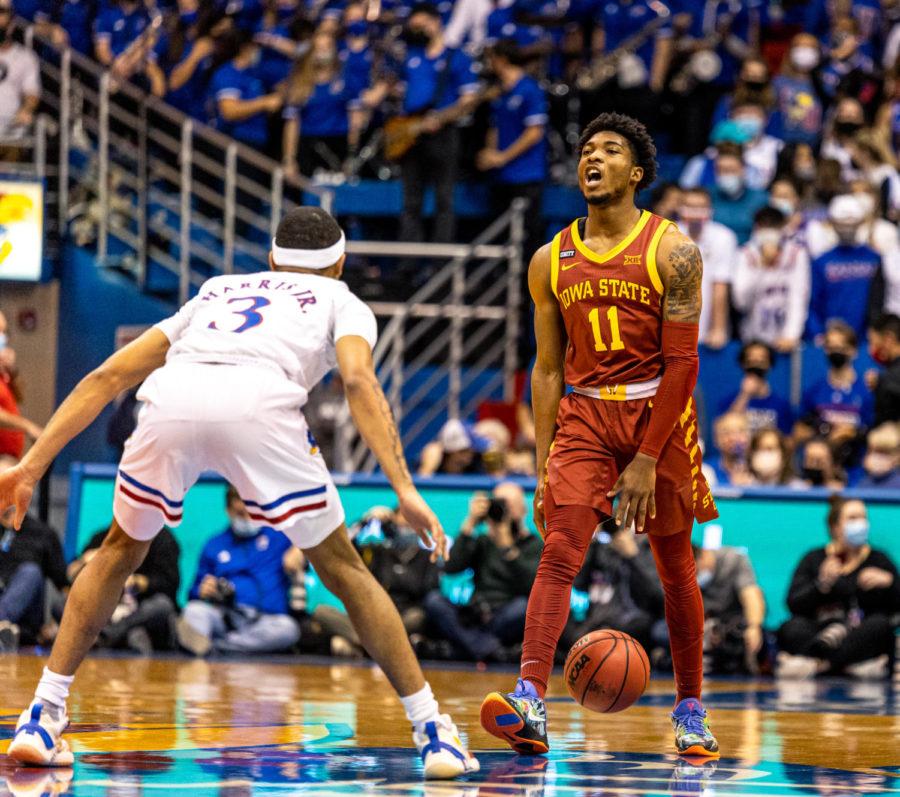 Tyrese Hunter calls out a play against the University of Kansas on Jan. 11 in Allen Fieldhouse. Hunter scored 12 points in his first game in Allen Fieldhouse.