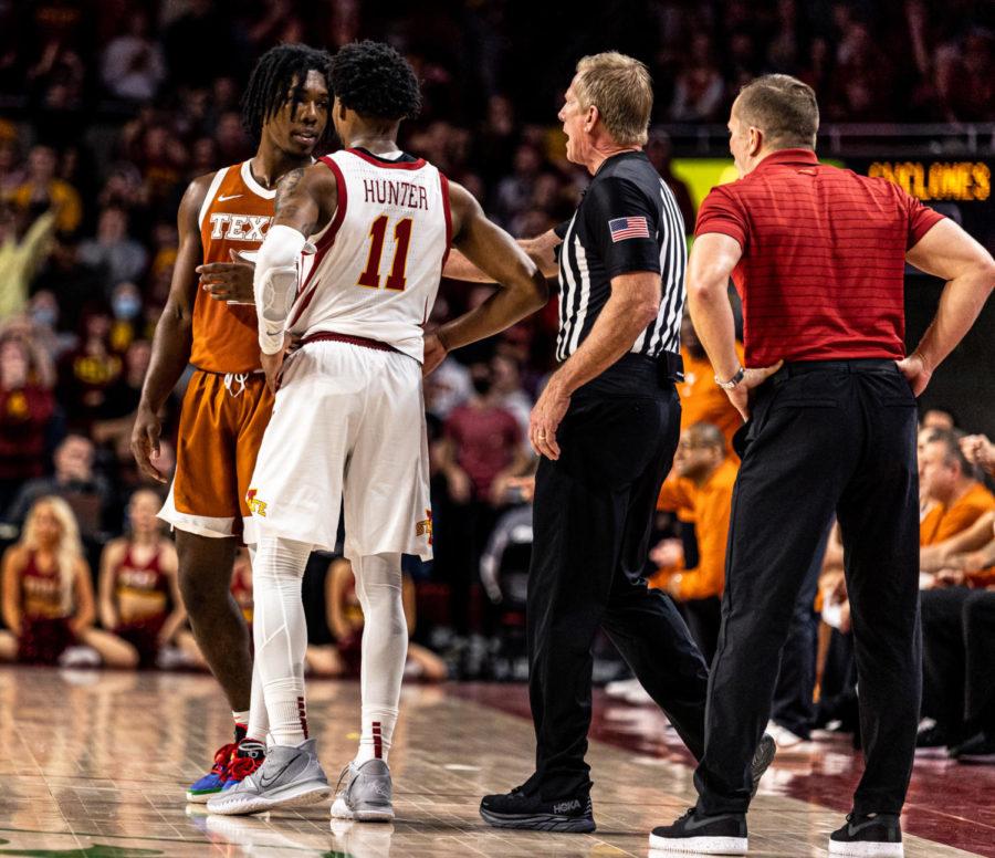 Tyrese Hunter talks with Texas guard Marcus Carr during the Cyclones 79-70 win over the Longhorns on Jan. 15 in Hilton Coliseum.