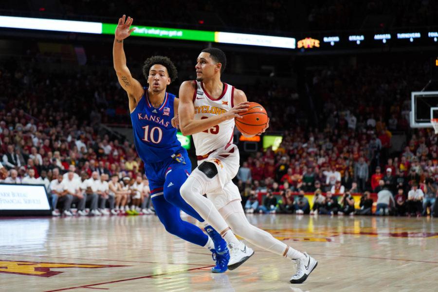 Tristan Enaruna drives to the basket against Kansas in a 70-61 loss on Feb. 1.