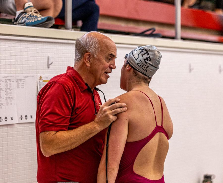 Iowa State swim and dive coach Duane Sorenson talks with a Cyclone swimmer Oct. 30, 2021.