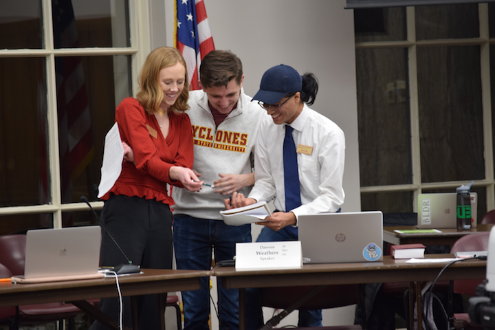 Student Government Vice President Megan Decker, Chief of Staff Jacob Ludwig and Vice Speaker Advait tallying vote counts to confirm two members to the Jack Trice Character Award Selection Committee. 