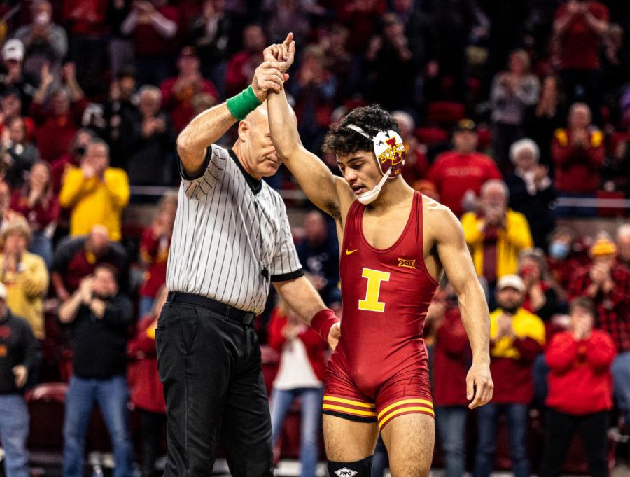 Kysen Terukina wins his match against West Virginia wrestler Killian Cardinale in the Cyclones' 31-9 over West Virginia on Feb. 4.