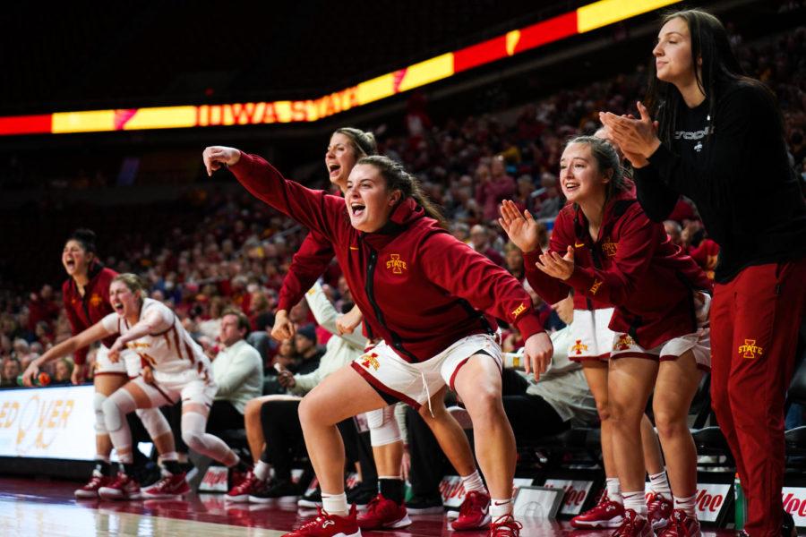 Maddie Frederick, along with other Iowa State womens basketball players, celebrate on the bench after a Cyclone three-pointer in Iowa States 70-55 win over Kansas State on Feb. 2.