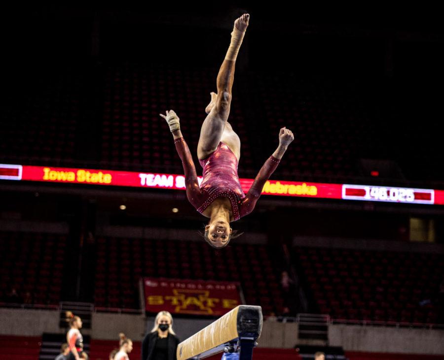 Loganna Basuel competes in the beam in the Cyclones gymnastics meet against Nebraska on Jan. 7.