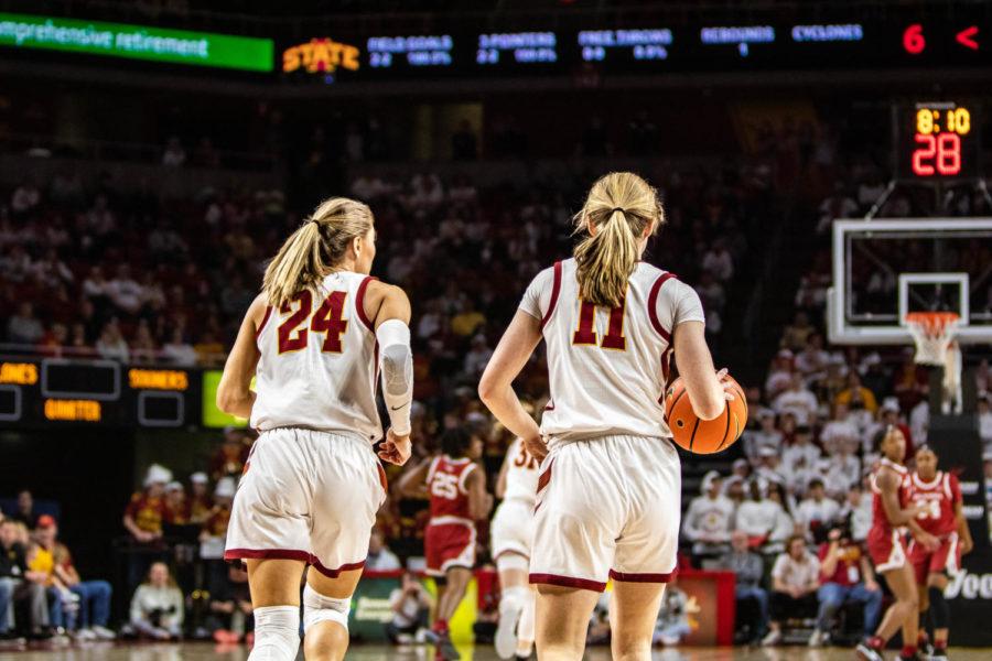 Iowa State players Ashley Joens (left) and Emily Ryan (right) run up the floor during the Cyclones 89-67 win over Oklahoma on Feb. 19.