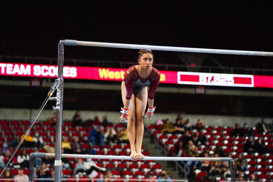 Loganne Basuel competes on the uneven bars against the University of West Virginia on Jan. 28.