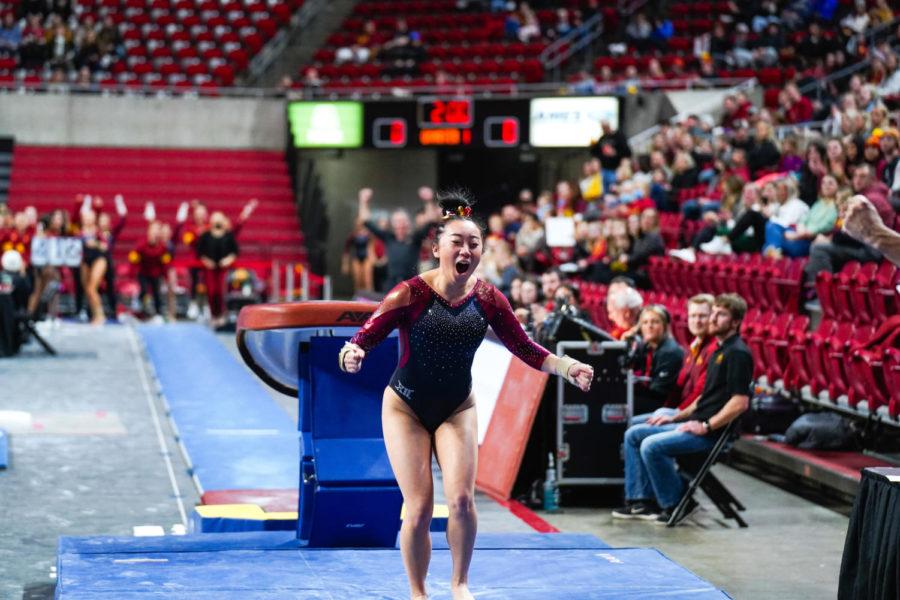 Iowa State gymnast Emilie Hong celebrates after finishing her routine in the vault event in the Cyclones meet against the University of West Virginia on Jan. 28.