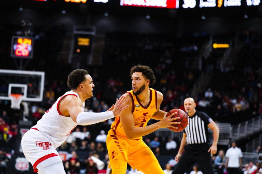Iowa State forward George Conditt IV holds the basketball as a play develops during the Cyclones 72–41 loss to Texas Tech at the 2022 Big 12 Mens Basketball Championship.