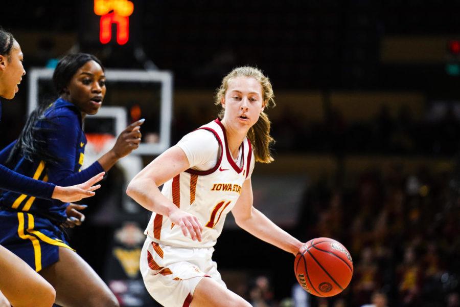 Iowa State guard Emily Ryan tries to pass the ball in the Cyclones game against the West Virginia Mountaineers in the first round of the Big 12 Womens Basketball Tournament on March 11 in Kansas City, Mo.