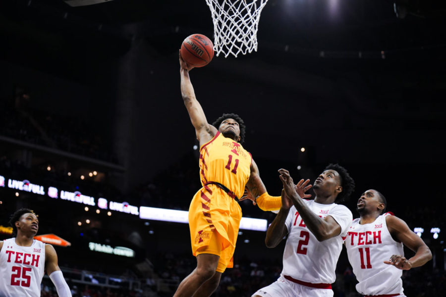 Tyrese Hunter dunks the ball against the Texas Tech Red Raiders at the Big 12 Mens Basketball Championship on March 10 in Kansas City, Mo.