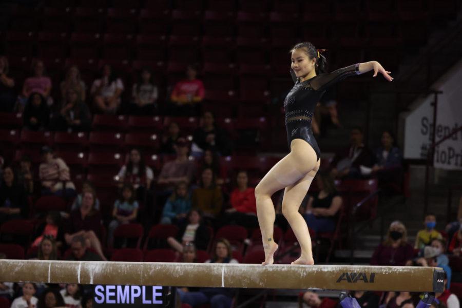 Meixi Semple competes on the balance beam at the 2022 Big 12 Gymnastics Championships on March 19 in Denver, Colo. (Photo courtesy of Ethan Mito/Clarkson Creative Photography)