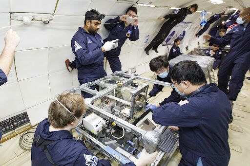 The NINJAS team tests their 3D printing process during a zero-gravity test flight.