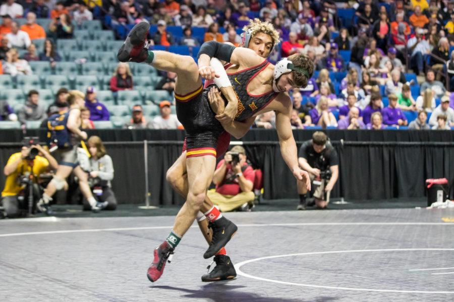 Ian Parker wrestles against Oklahomas Jacob Butler at the Big 12 Wrestling Championship on March 5 at the BOK Center in Tulsa, OK.(Photo by Brett Rojo/Big 12 Conference)