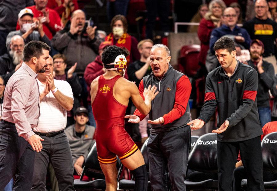 Iowa State head coach Kevin Dresser celebrates with Kysen Terukina in the Cyclones 31-9 win against West Virginia on Feb. 4 in Hilton Coliseum.