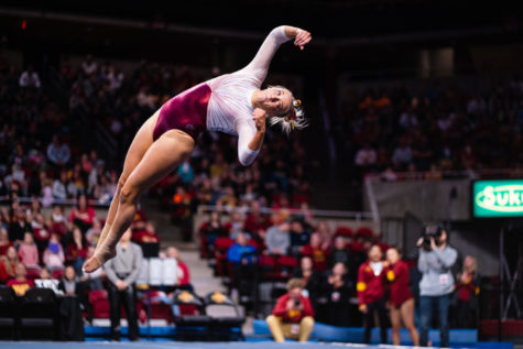Iowa State junior Laura Cooke performs in the floor exercise in the Cyclones gymnastics meet against the University of Iowa on march 4.