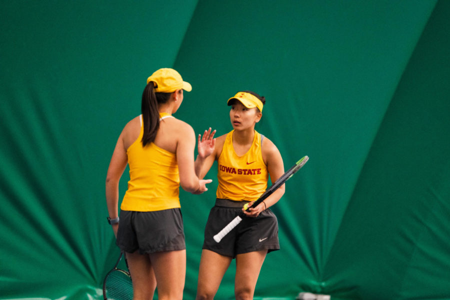 Thasaporn+Naklo+talks+with+her+doubles+partner+Christin+Hsieh+in+the+Cyclones+match+against+the+Oklahoma+Sooners+April+8%2C+2022.