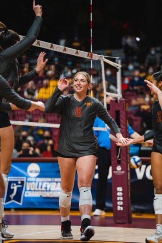 Eleanor Holthaus smiles after recording a point against Stanford in the NCAA tournament on Dec. 3.